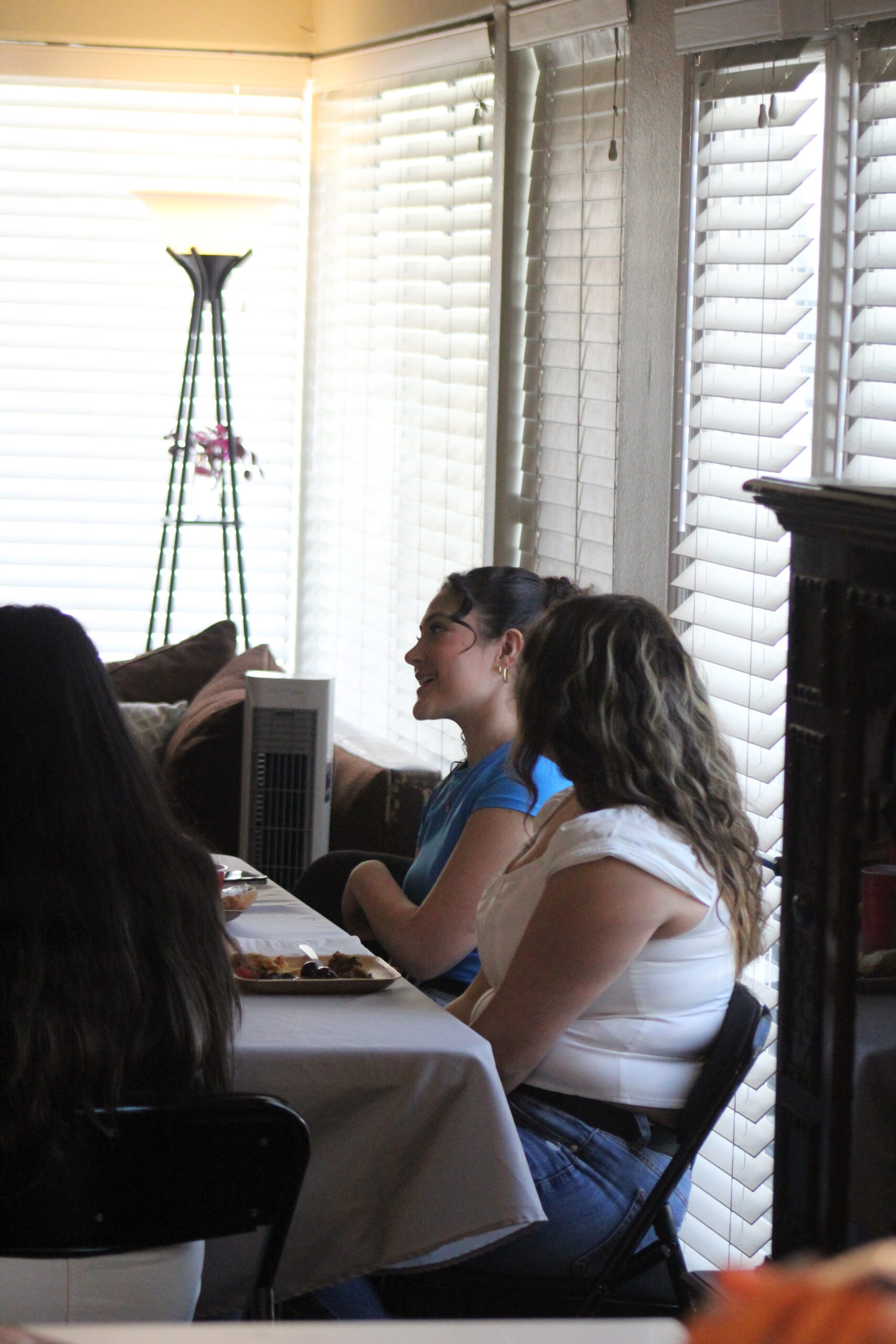 Young adults around a table for a small group Bible study.